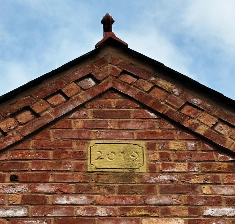 Date stone in house wall